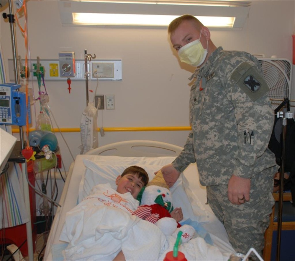 Soldiers bring Christmas spirit to ailing children