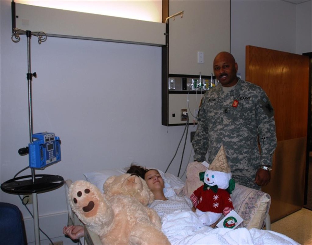 Soldiers bring Christmas spirit to ailing children