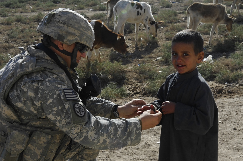 Soldiers deliver school supplies to children in Al Buaiibyes