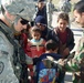 Soldiers help children start New Year off right with new school supplies
