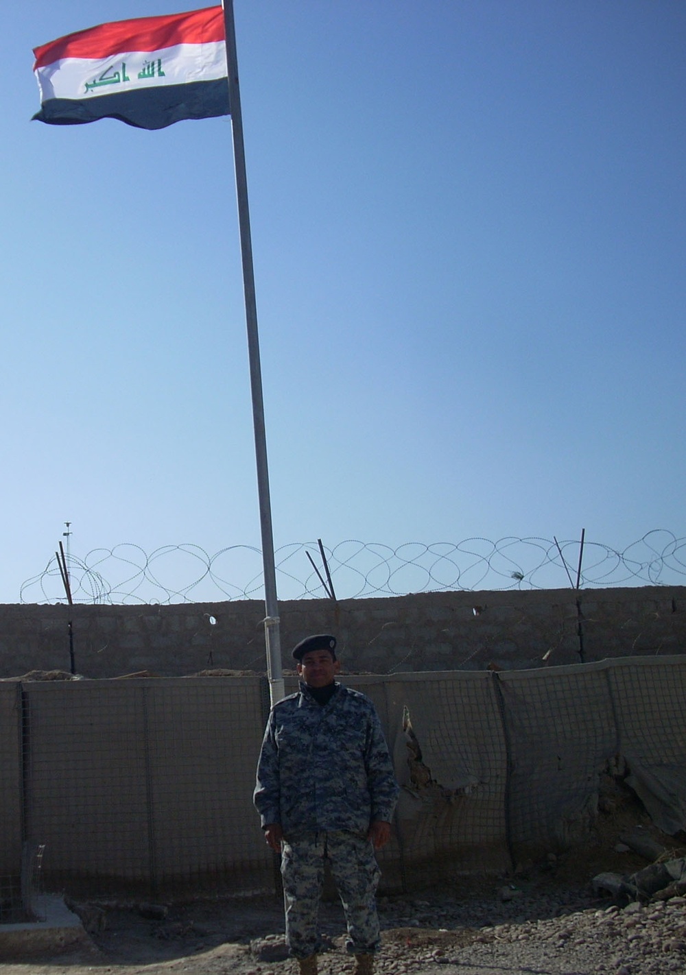 Iraqi National Police fly nation's flag over Joint Security Station Aamel in Baghdad's Rashid