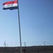 Iraqi National Police fly nation's flag over Joint Security Station Aamel in Baghdad's Rashid