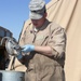 Cavalry soldiers maintain vehicles