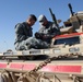 Cavalry soldiers maintain vehicles