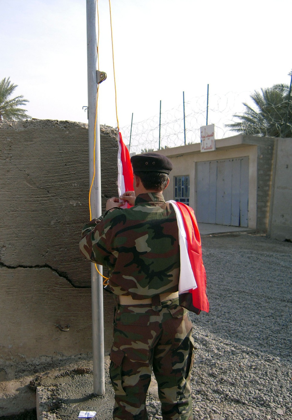 Iraqi national flag flies above Hor al Bash