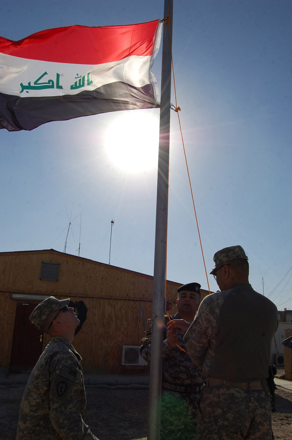 Wolfhounds, Iraqi Security Force raise Iraqi flag over JSS Istaqlal