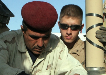 Marines With Maintenance Company, Combat Logistics Battalion 2, 1st Marine Logistics Group, Conducted an Iraqi Partnership Dec. 31, 2008. the CLB-2 Mechanics Taught Iraqis Basic Vehicle Maintenance.