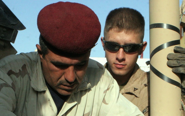 Marines With Maintenance Company, Combat Logistics Battalion 2, 1st Marine Logistics Group, Conducted an Iraqi Partnership Dec. 31, 2008. the CLB-2 Mechanics Taught Iraqis Basic Vehicle Maintenance.