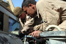 Marines With Maintenance Company, Combat Logistics Battalion 2, 1st Marine Logistics Group, Conducted an Iraqi Partnership Dec. 31, 2008. the CLB-2 Mechanics Taught Iraqis Basic Vehicle Maintenance.