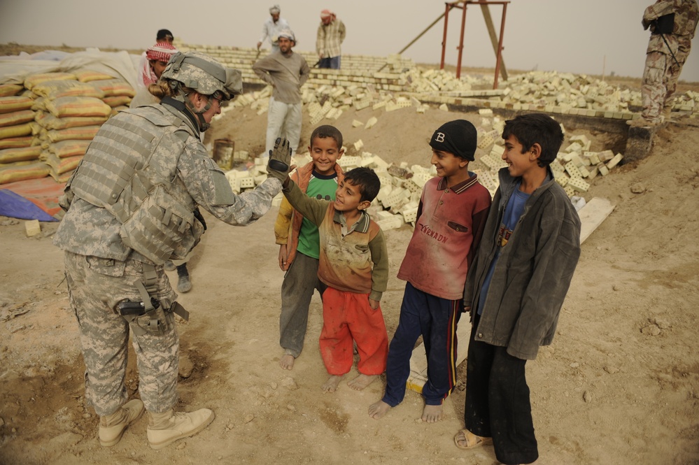 Soldiers tour schools under construction