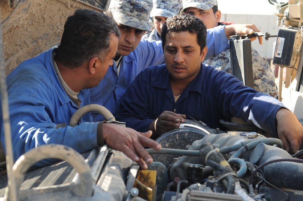 Paratroopers train National Police mechanics on vehicle maintenance