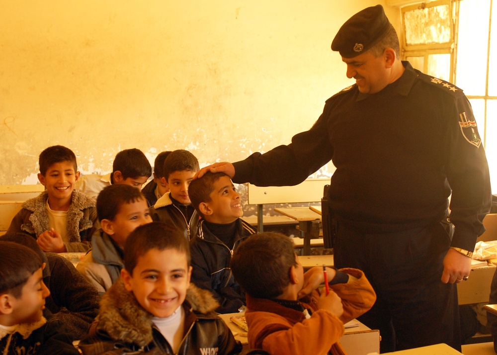 Iraqi Police give back - Military Police gather donated items for Iraqi school children