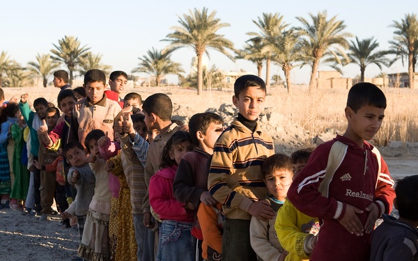 Generous donations help keep Karmah children warm during winter