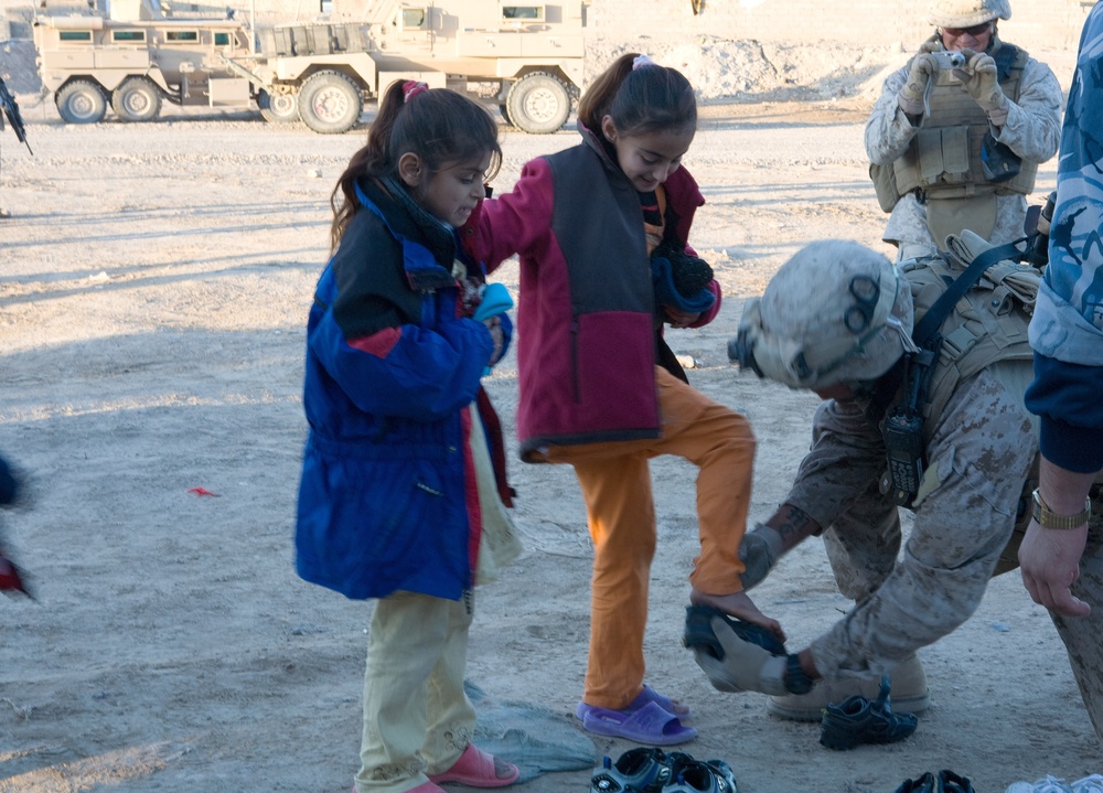 Generous donations help keep Karmah children warm during winter