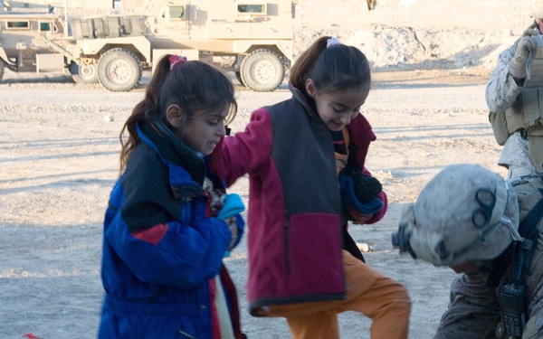Generous donations help keep Karmah children warm during winter
