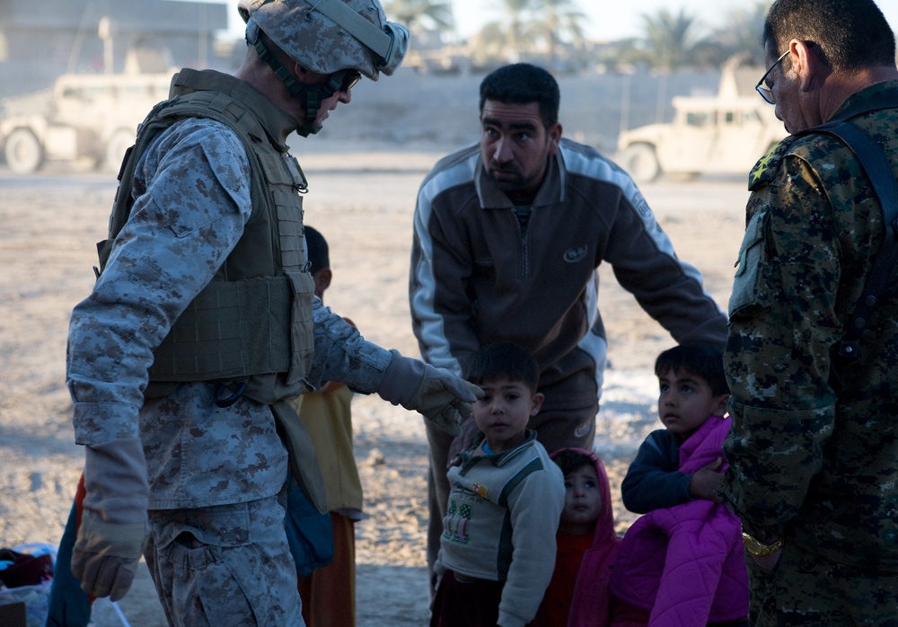 Generous donations help keep Karmah children warm during winter