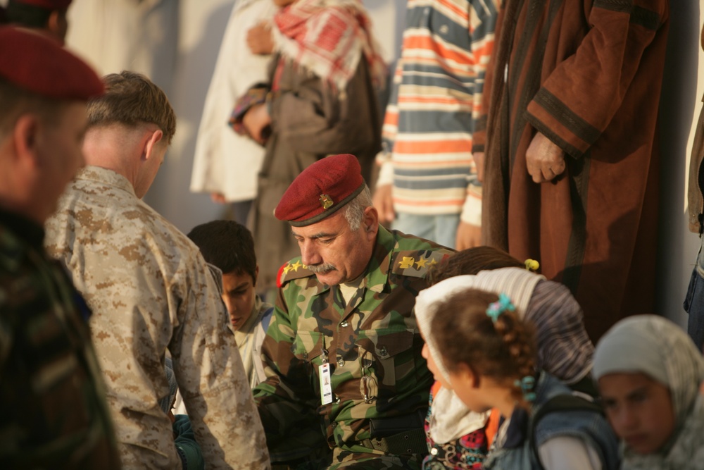 Coalition forces provide medical care in Harwan