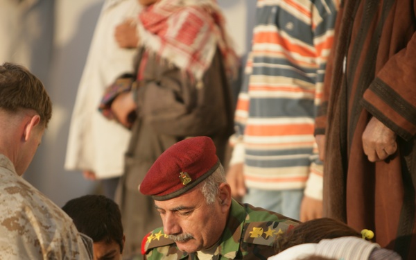 Coalition forces provide medical care in Harwan