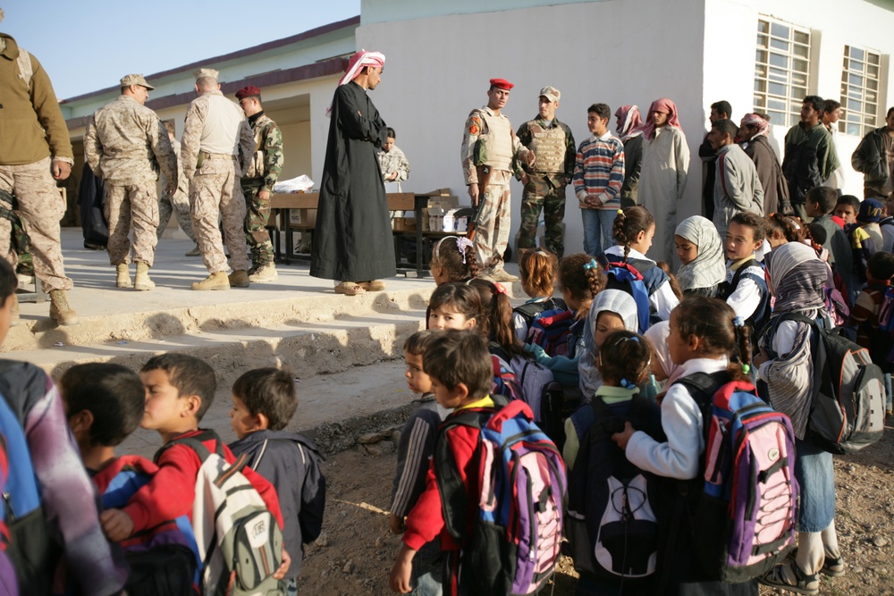 Coalition forces provide medical care in Harwan