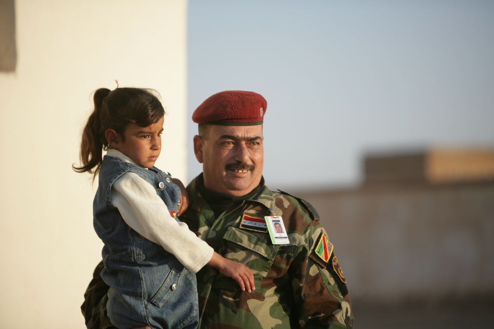 Coalition forces provide medical care in Harwan