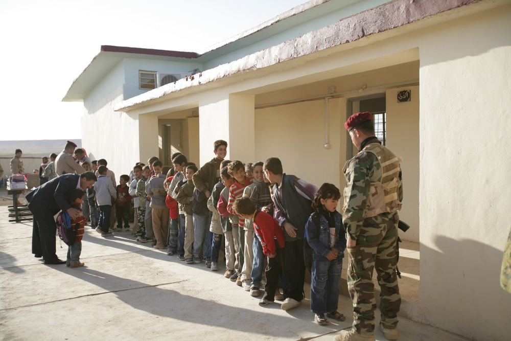 Coalition forces provide medical care in Harwan