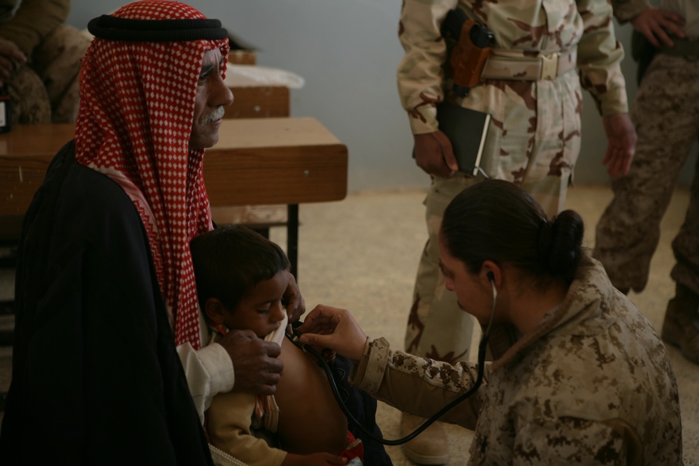 Coalition forces provide medical care in Harwan