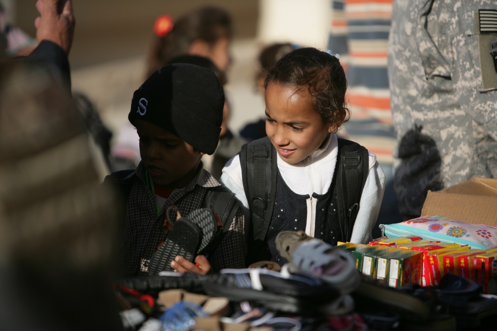 Coalition forces provide medical care in Harwan