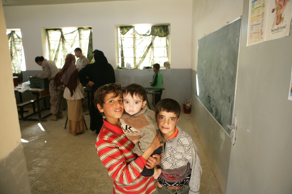 Coalition forces provide medical care in Harwan