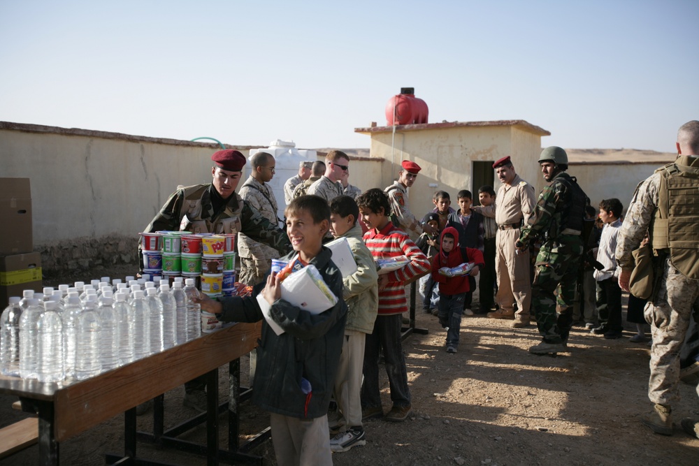 Coalition forces provide medical care in Harwan