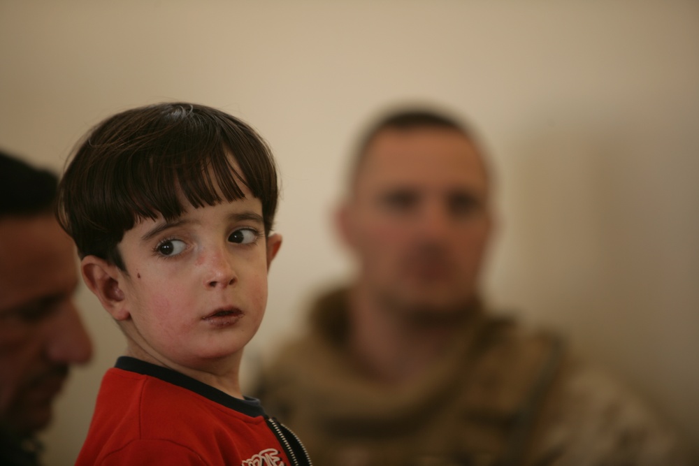 Coalition forces provide medical care in Harwan