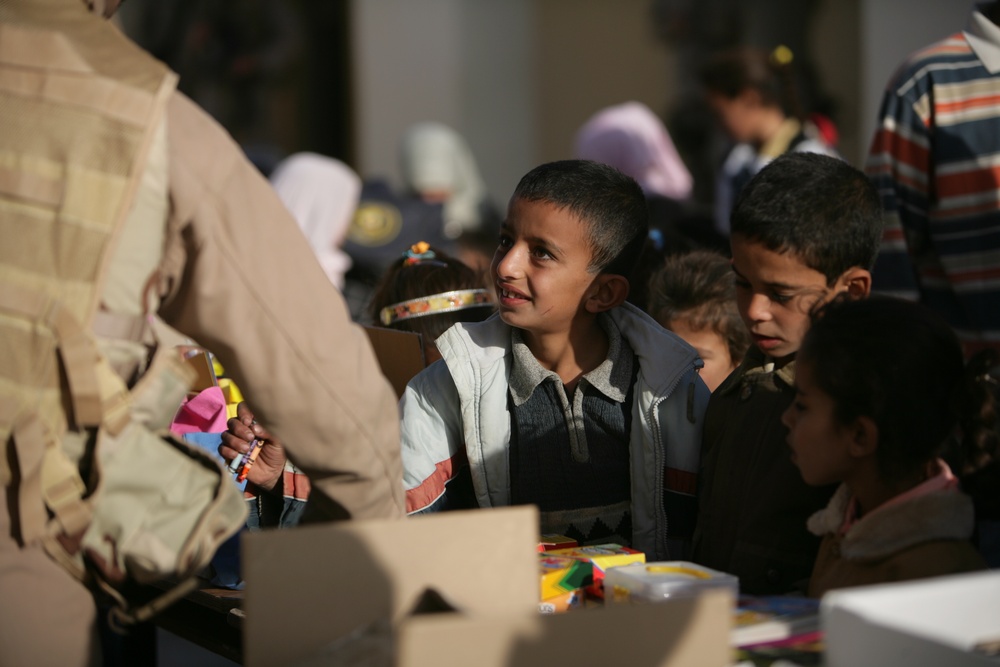 Coalition forces provide medical care in Harwan