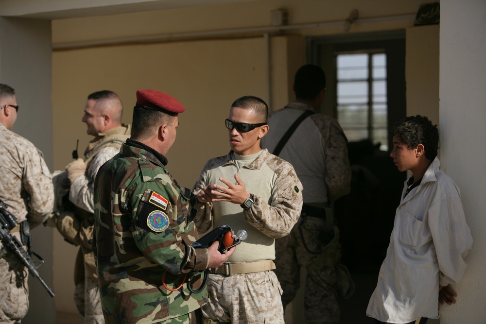 Coalition forces provide medical care in Harwan