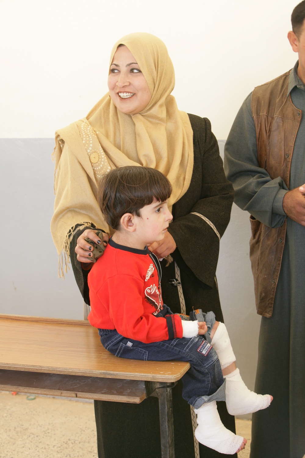 Coalition forces provide medical care in Harwan