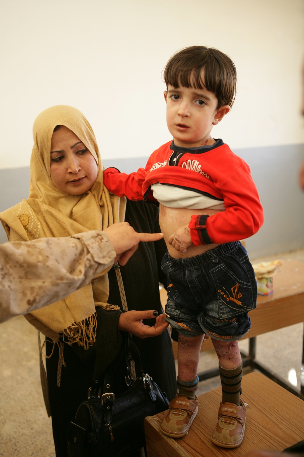 Coalition forces provide medical care in Harwan