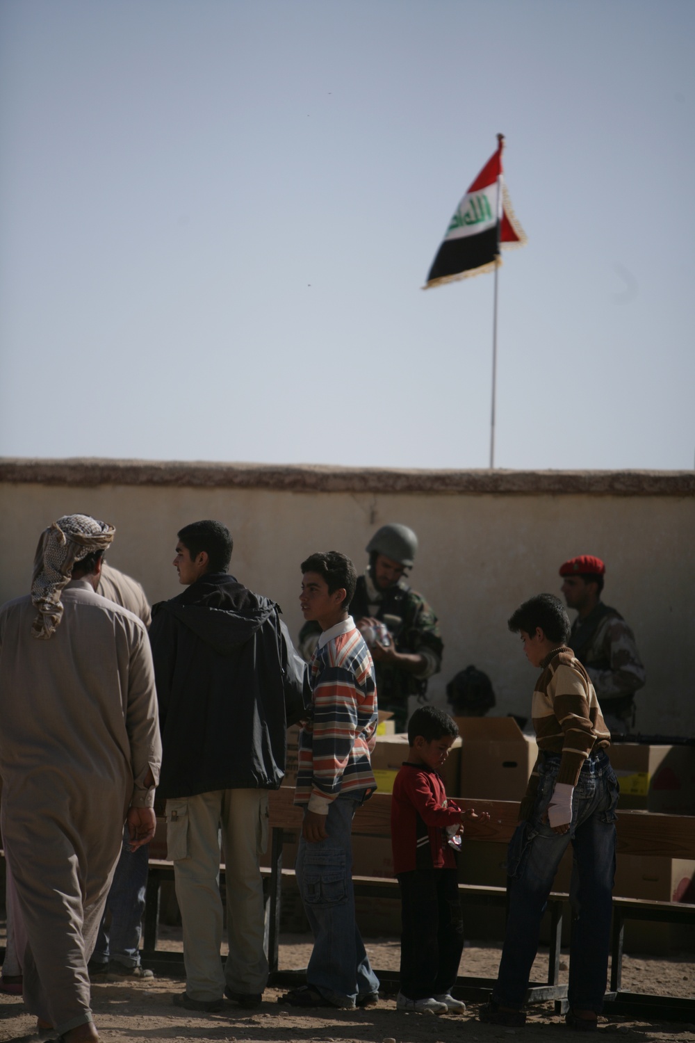Coalition forces provide medical care in Harwan