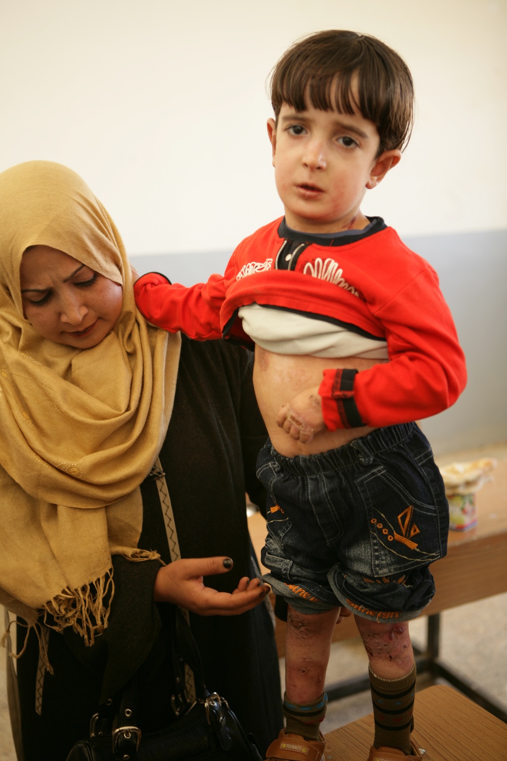 Coalition forces provide medical care in Harwan