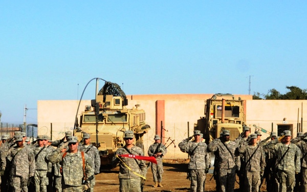 Troop C, 1st Squadron, 10th Cavalry Regiment Soldiers hold combat patch