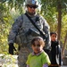 Iraqi children look up to Multi-National Division-Baghdad Soldiers during MND-B Commanding General's visit to Taji