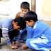 Iraqi children play in the streets of Basra