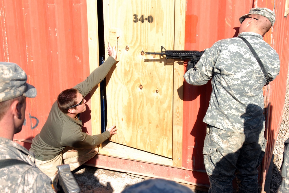 Navy Explosive Ordnance Disposal teach House-Borne Improvised Explosive Device training to Soldiers