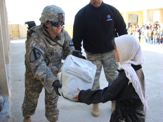 Iraqi children receive school supplies