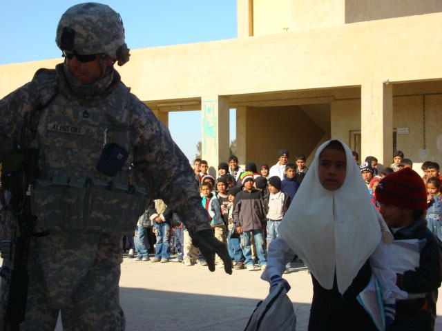 Iraqi children receive school supplies