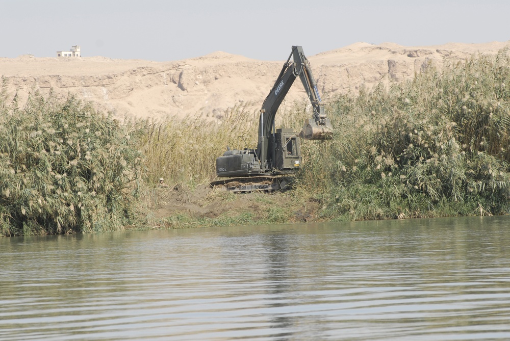 Naval Mobile Construction Battalion 27 constructs river barrier in Western Iraq