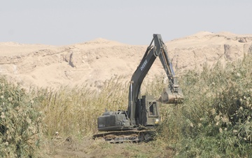 Naval Mobile Construction Battalion 27 builds constructs river barrier in Western Iraq