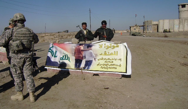 Headhunters, Iraqi army distribute information billboards