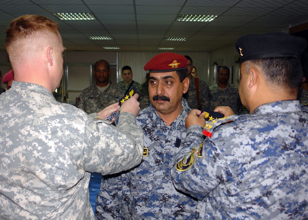 Iraqi national police officers promoted by Multi-National Division-Baghdad Soldiers