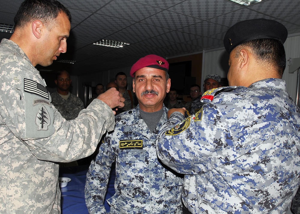Iraqi national police officers promoted by Multi-National Division-Baghdad Soldiers