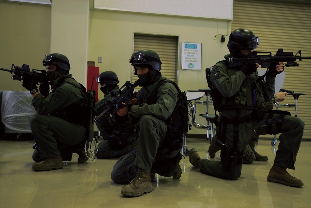 Special Reaction Team Marines on Okinawa rehearse building takedown procedures, hone close-quarters battle skills