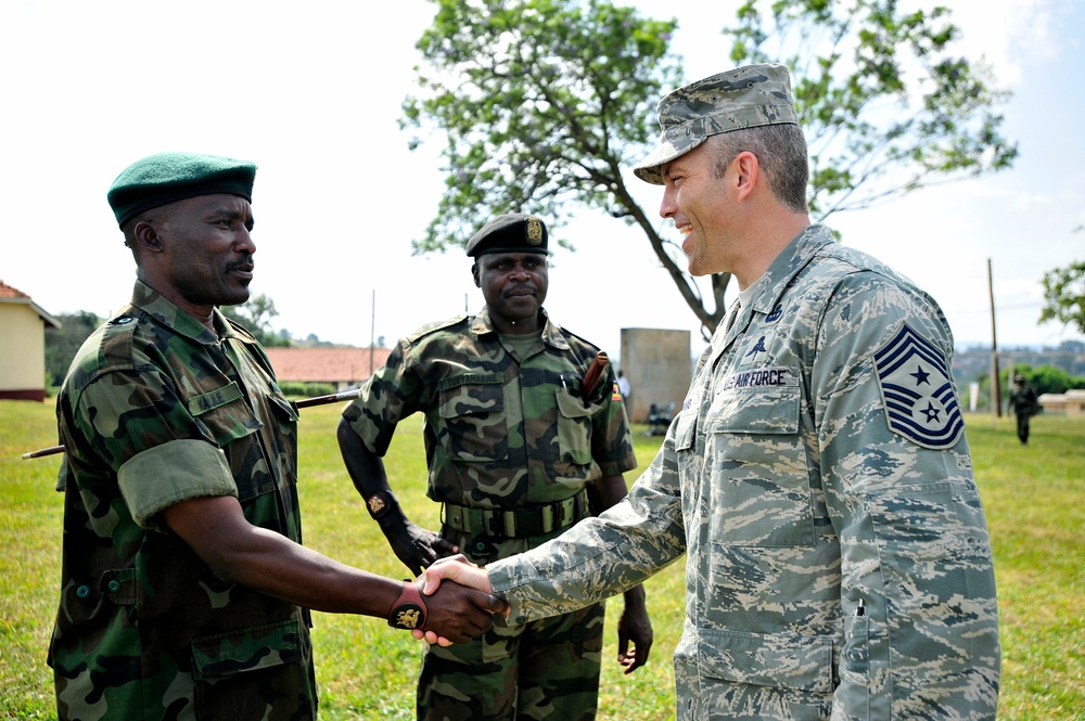 Chief Master Sgt. Martin Klukas, Combined Joint Task Force-Horn of Africa Senior Enlisted Leader, Talks to Uganda Peoples Defense Force Soldiers Before Attending a Graduation Ceremony for the UPDF Non-Commissioned Officers Academy