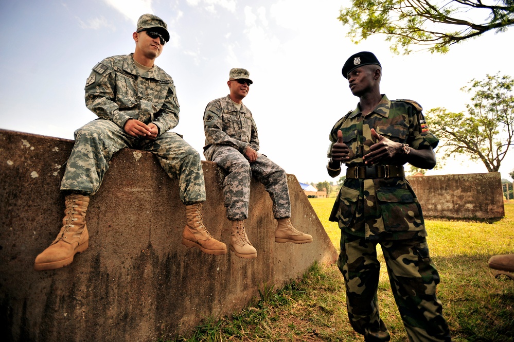 U.S. Soldiers Attached to Combined Joint Task Force-Horn of Africa Talk to a Uganda Peoples Defense Force Soldier in Jinja.